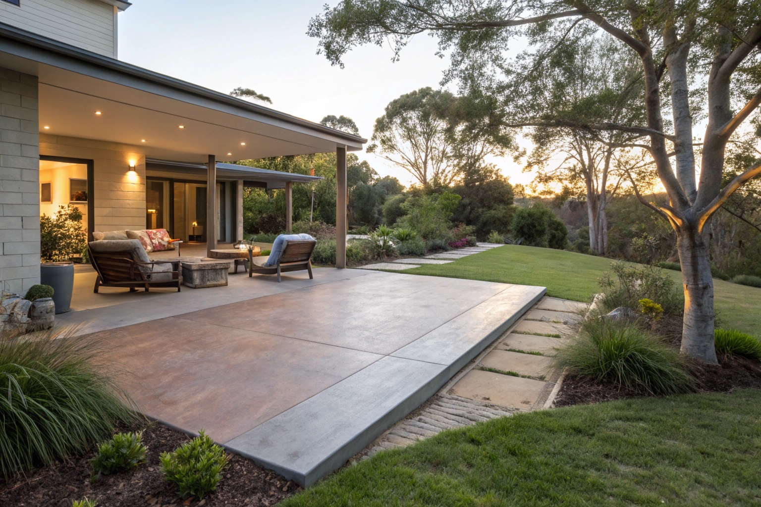 Coloured concrete patio slab extending from modern home in Newcastle