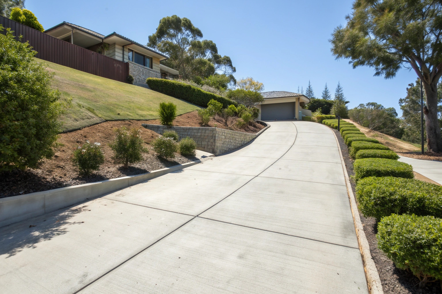 Sloping concrete driveway installation Newcastle